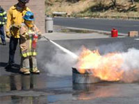 Fire Squirts Camper putting fire out